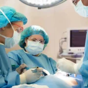 Orthopedic surgeon discussing outpatient hip and knee replacement with a patient