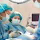 Orthopedic surgeon discussing outpatient hip and knee replacement with a patient