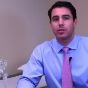 Dr. Matthew Russo explaining the direct anterior approach to total hip replacement using a hip anatomy model.
