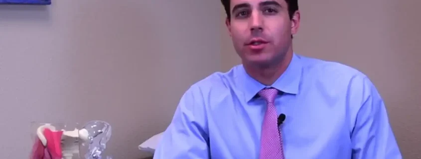 Dr. Matthew Russo explaining the direct anterior approach to total hip replacement using a hip anatomy model.